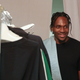 Pusha T looks over outfits backstage at the John Elliott fashion presentation during New York Fashion Week: Men’s S/S 2017 on July 13, 2016 in New York City.